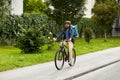 food delivery man with bag riding bicycle Royalty Free Stock Photo