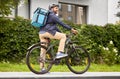 food delivery man with bag riding bicycle Royalty Free Stock Photo