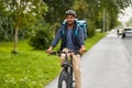 food delivery man with bag riding bicycle Royalty Free Stock Photo