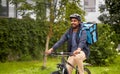 food delivery man with bag riding bicycle Royalty Free Stock Photo