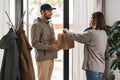 food delivery man giving order to female customer Royalty Free Stock Photo