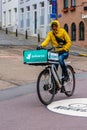 Food Delivery man riding bike on city road Royalty Free Stock Photo