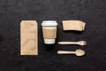 Food delivery with paper bags and plastic cup on dark table background top view mockup Royalty Free Stock Photo