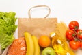 Food delivery service. Buy products online during quarantine. Healthy food with paper bag on white background. Salad, sunflower oi