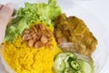 Food Delivery service: Chicken Biryani Muslim yellow rice with chicken opening cling wrap and take out food in plastic box. Royalty Free Stock Photo