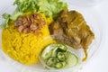Food Delivery service: Chicken Biryani Muslim yellow rice with chicken opening cling wrap and take out food in plastic box. Royalty Free Stock Photo