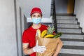 Food delivery service, male worker holding grocery bag, express food order Royalty Free Stock Photo