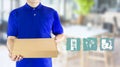 Food delivery service or order food online. Delivery man hand holding fast food packaging in blue uniform and icon symbol media on Royalty Free Stock Photo