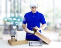 Food delivery service for order online shopping concept and icon media symbol. Delivery man in blue uniform hand holding paper bag Royalty Free Stock Photo