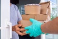 Food delivery staff is wear gloves to prevent germs while delivering Royalty Free Stock Photo