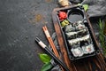 Food delivery. Sushi rolls with caviar and crab. Royalty Free Stock Photo