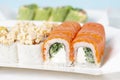 Food delivery takeaway concept. Lunch box with sushi set. Assorted sushi Philadelphia roll cheese with squid on white light Royalty Free Stock Photo