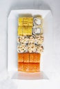 Food delivery takeaway concept. Lunch box with sushi set. Assorted sushi Philadelphia roll cheese with squid on white light Royalty Free Stock Photo