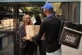 Food delivery to office, cheerful client holding pizza boxes Royalty Free Stock Photo