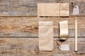 Food delivery workdesk with paper bags and flatware table background top view mock-up Royalty Free Stock Photo