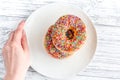 food design with donat on plate on table background top view