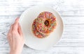 Food design with donat on plate on table background top view