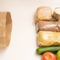 food donation. Buckwheat, eggs. cucumber, bread, apple, tomato and millet on a white background