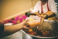 Food donation to help people in hunger relief : hands of the poor receive food from the donor`s share Royalty Free Stock Photo