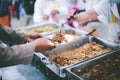 Food donation to help people in hunger relief : hands of the poor receive food from the donor`s share Royalty Free Stock Photo