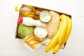 Food donations on the white wooden background. Top view