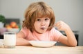 Food and drink for kids. Child eating healthy food. Cute little boy having soup for lunch. Royalty Free Stock Photo