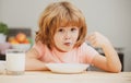 Food and drink for kids. Child eating healthy food. Cute little boy having soup for lunch. Royalty Free Stock Photo