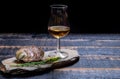 Food and drink pairing, fresh raw European flat oyster grown in Brittany in Belon river, France and scotch single malt whisky from