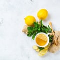 Food and drink, still life health care concept. Ginger tea infusion beverage in white cup with lemon mint honey on a kitchen table