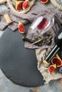 Bottle, corkscrew, glass of red wine, figs on a table Royalty Free Stock Photo