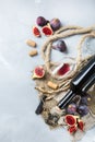 Bottle, corkscrew, glass of red wine, figs on a table Royalty Free Stock Photo