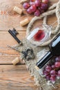 Bottle, corkscrew, glass of red wine, grapes on a table Royalty Free Stock Photo