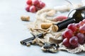 Bottle, corkscrew, glass of red wine, grapes on a table Royalty Free Stock Photo