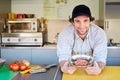 Food entrepeneur looking pleased with his quality hamburger meat