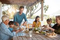 Food is a family affair. a family enjoying a meal together at home. Royalty Free Stock Photo
