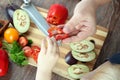 Food, family, cooking and people concept - Man giving paprika to the daughter Royalty Free Stock Photo