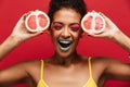 Food fashion photo of delighted afro american woman having fun h