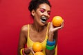 Food fashion photo of joyful mixed-race woman with colorful make