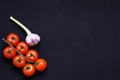 Food frame. Pasta ingredients. Cherry-tomatoes, spaghetti pasta, garlic, basil, parmesan and spices on dark background, copy Royalty Free Stock Photo