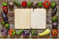 Food frame with vitage cookbook on wooden background. Royalty Free Stock Photo