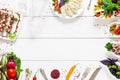 Food frame on white wooden table, free space