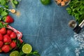 Food fresh ingredients for making lemonade, infused detox water or cocktail. Strawberries, lime, mint, basil, cane sugar,  ice cub Royalty Free Stock Photo