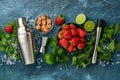 Food fresh ingredients for making lemonade, infused detox water or cocktail. Strawberries, lime, mint, basil, cane sugar, ice cub Royalty Free Stock Photo