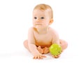 Food, health and child concept. Cute baby with green apple on a Royalty Free Stock Photo