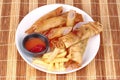 Deep fried spring roll,and frence fries sreved with tomato souce and chili sauce.