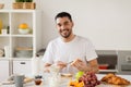 Man eating toast with coffee at home kitchen Royalty Free Stock Photo