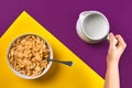 Food, healthy eating, people and diet concept - close up of woman eating muesli with milk for breakfast over purple and Royalty Free Stock Photo