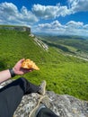 food on a hike a man with bread sitting on a mountain journey