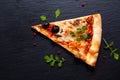 Homemade Napoli Pizza or anchovies pizza on black slate stone