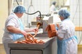 Food industry: workers in the production of original German brat Royalty Free Stock Photo